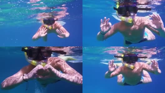 男孩在红海里潜水高清在线视频素材下载