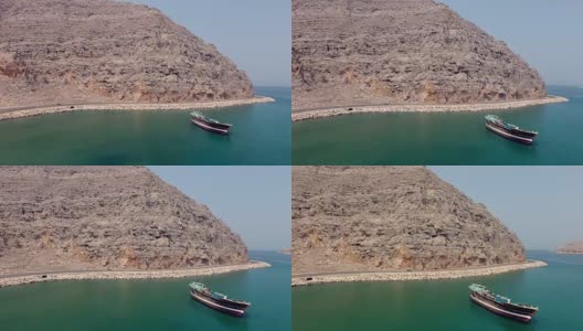 Flying over abandoned boat Musandam Sultanate of Oman高清在线视频素材下载