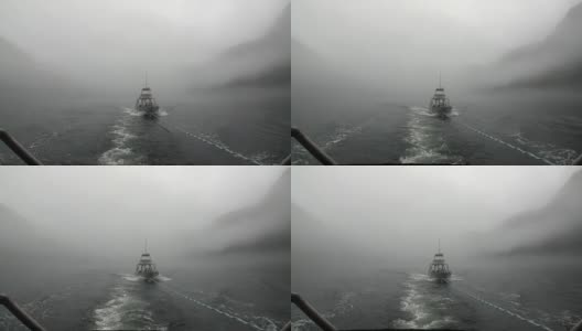 拖船在雾在太平洋的水在背景山脉阿拉斯加。高清在线视频素材下载