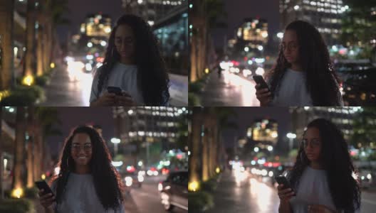 一个晚上在城里用手机的女人高清在线视频素材下载