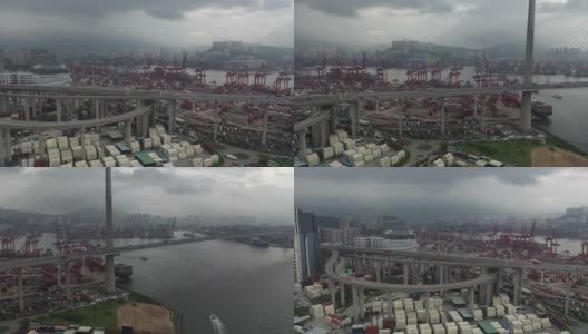 香港货柜码头及昂船洲大桥的交通车辆及货柜船坞的无人机电影高清在线视频素材下载