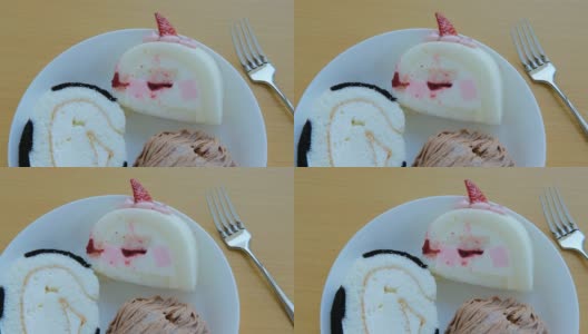 草莓奶油瑞士卷和栗子蛋糕跟踪镜头高清在线视频素材下载