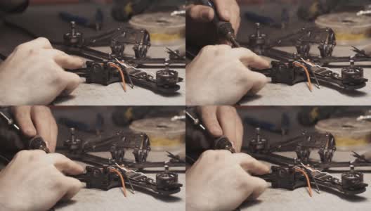 Guy焊接无人机FPV电线。回框架视图高清在线视频素材下载