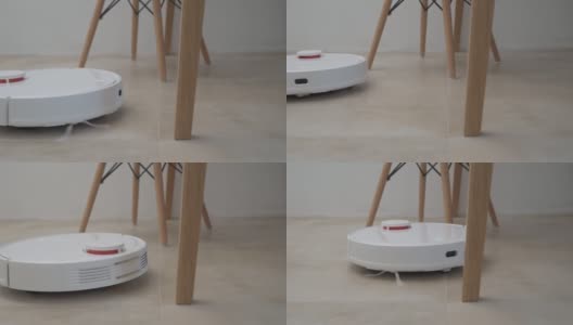 机器人吸尘器与家具在地板上工作，机器人吸尘器的障碍。现代智能家居高清在线视频素材下载