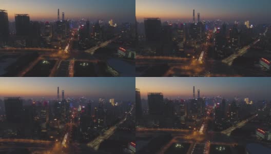 《暮色中的上海天际线》陆家嘴区和世纪大道。鸟瞰图。无人机是向前和向上飞行。远景高清在线视频素材下载