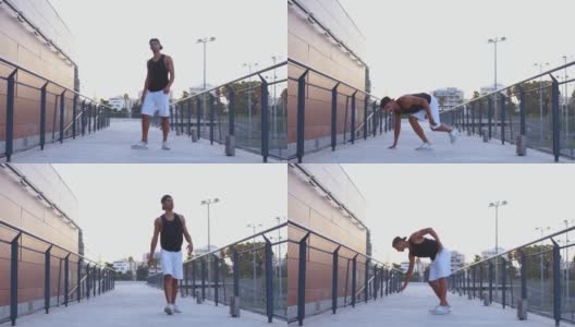 年轻的肌肉潮男做霹雳舞冻结移动特技高清在线视频素材下载