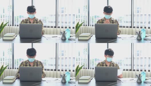 商人戴着防护面罩在办公室办公桌前工作的4k视频画面高清在线视频素材下载