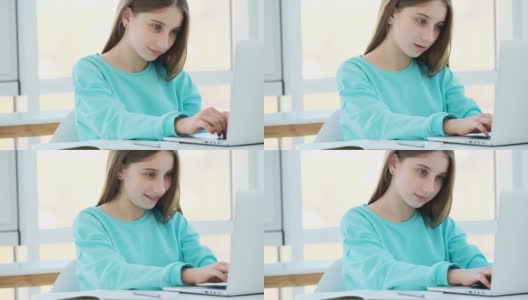 可爱女孩用笔记本电脑高清在线视频素材下载