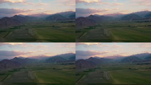 鸟瞰图的风景与绿色的山谷在夏季日落联合国吉尔吉斯斯坦高清在线视频素材下载