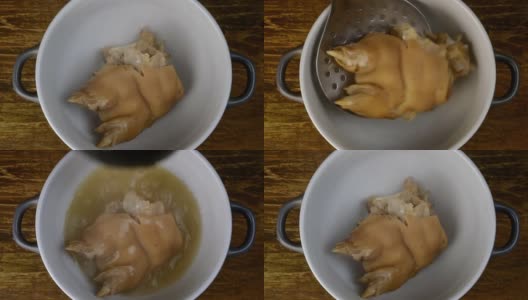煮熟的猪腿，与高汤倒在陶瓷碗中食用或做肉冻。高清在线视频素材下载