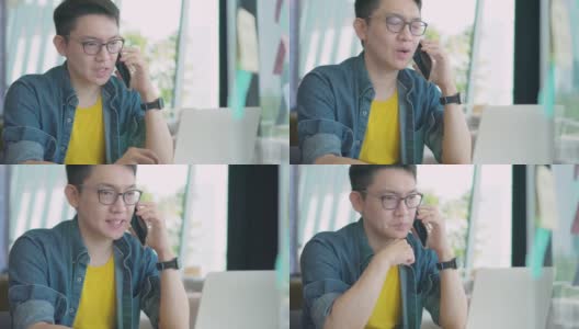特写英俊的亚洲年轻人在使用笔记本电脑聊天，使用网络摄像头，户外技术工作互联网。他正在家里开视频会议高清在线视频素材下载