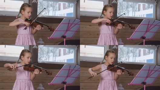 可爱的小小提琴家在家练习高清在线视频素材下载