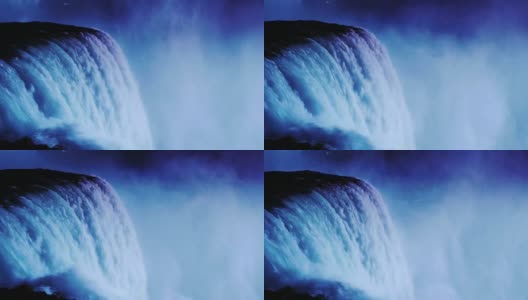 尼亚加拉大瀑布的夜间照明。加拿大海岸的泛光灯照亮了水流高清在线视频素材下载