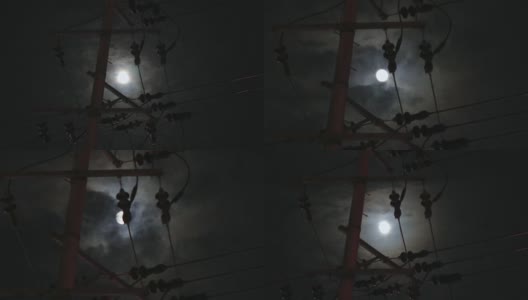 电线杆和电线在移动云在月球上在时间推移的观点高清在线视频素材下载