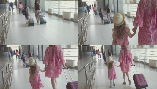 后视图的家庭旅客手提箱在国际机场下降高清在线视频素材下载