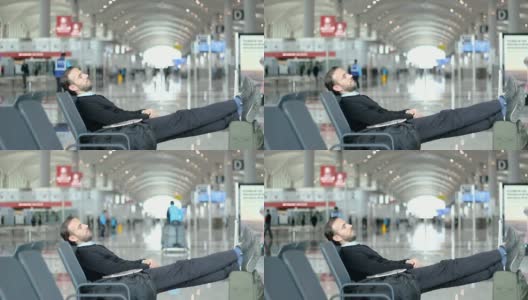 在机场候机室睡觉的旅客高清在线视频素材下载
