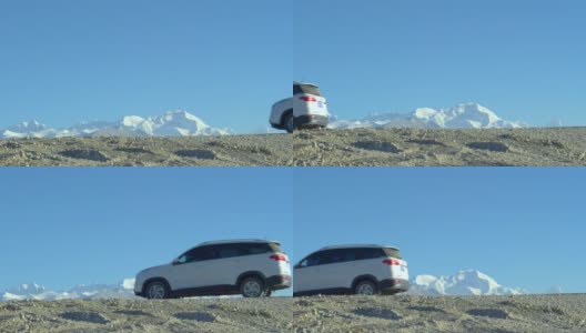 慢镜头:越野车沿着砾石小路行驶，沿途可以看到冰川。高清在线视频素材下载
