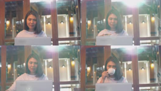 女性自由职业者用她的笔记本电脑工作，在咖啡馆喝咖啡，慢镜头高清在线视频素材下载