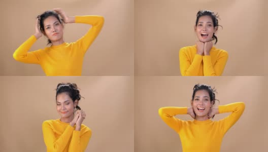 4K中拍摄的快乐年轻美丽的亚洲女人的肖像女孩的脸和身体穿着黄色长袖衬衫都在微笑孤立的背景。人的面部和身体具有快乐放松的情绪概念。高清在线视频素材下载
