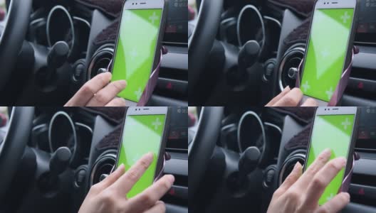 女人在路上开车并使用绿屏智能手机高清在线视频素材下载
