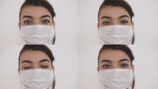 亚洲实习生，带着医用面具的女医务人员。高清在线视频素材下载
