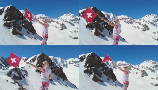 Diavolezza上的女孩与瑞士国旗慢动作高清在线视频素材下载