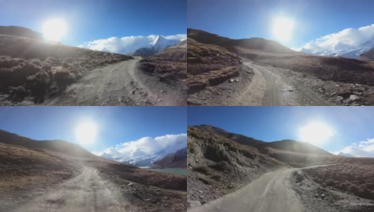在冬季行驶在高海拔的山路上的汽车高清在线视频素材下载