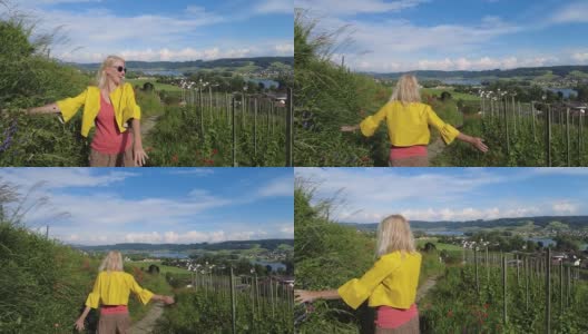 一个女人走在瑞士的葡萄园里高清在线视频素材下载