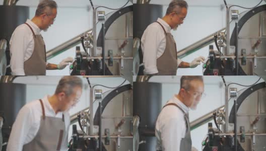 亚裔华裔高级技工操作咖啡烘焙机的控制面板触摸屏，为咖啡烘焙过程做准备高清在线视频素材下载