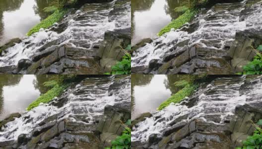 水从公园的石头上流下来高清在线视频素材下载