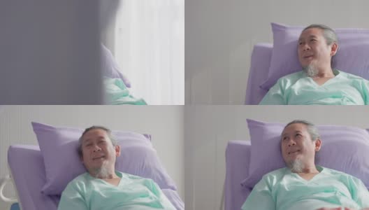 在医院的病房里，一位亚洲老年男性病人躺在床上。高清在线视频素材下载