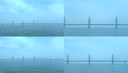 从横跨大海的雄伟大桥上飞驰而过高清在线视频素材下载