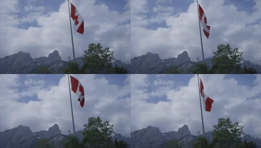 加拿大国旗对山区景观-慢动作高清在线视频素材下载