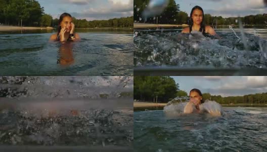15岁的少女在湖里游泳和戏水。高清在线视频素材下载