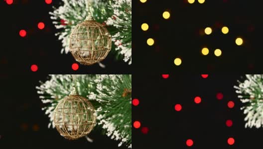 不寻常的装饰-一个圆形的棕色玩具在圣诞树上，散，轻，黑色，花环，凸轮移到右边高清在线视频素材下载