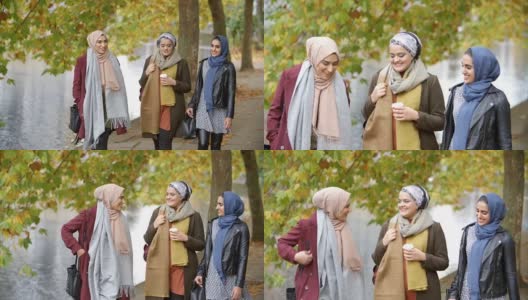 英国穆斯林女性朋友在城市的河边散步高清在线视频素材下载