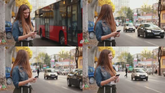 年轻漂亮的女人在人行道上用手机找出租车高清在线视频素材下载