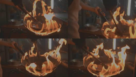 街头小吃:厨师用火炒高清在线视频素材下载