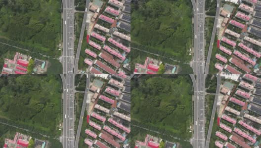 无人机在上海的高速公路和树木公园上空飞行高清在线视频素材下载