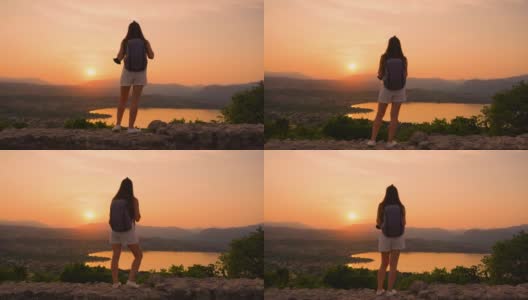 女孩在山中的红色日落高清在线视频素材下载