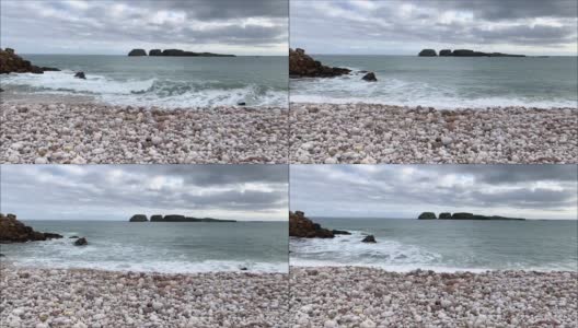 海浪拍打着卵石滩高清在线视频素材下载