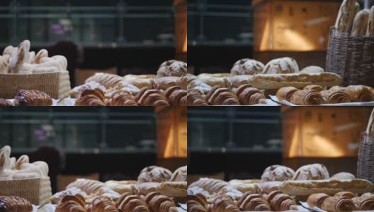 一个移动的镜头在面包房产品博览会上，几块饼干和面包房产品躺在桌子上高清在线视频素材下载