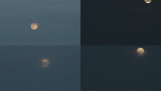 在夜晚的天空中出现一轮满月。高清在线视频素材下载
