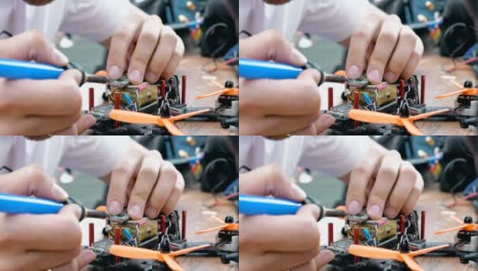 人的手焊接细节组装FPV无人机高清在线视频素材下载