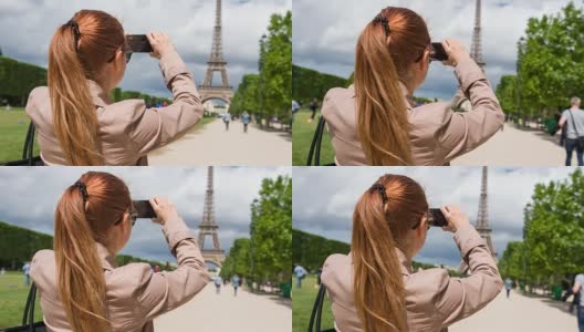 在战神广场的女人正在拍摄埃菲尔铁塔高清在线视频素材下载