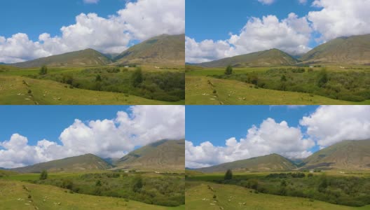 美丽的山川景观，绿色的草地和蓝天时光流逝高清在线视频素材下载