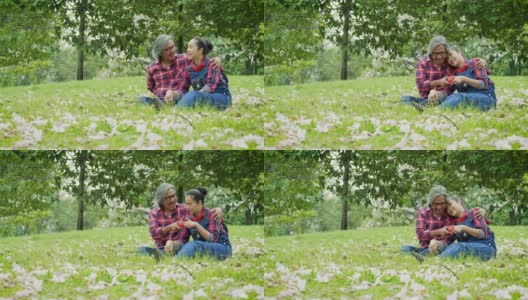 快乐的亚洲成熟夫妇放松和花时间一起在公园户外高清在线视频素材下载