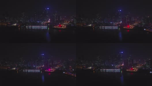 夜光青岛市海岸线著名的市中心海湾纪念碑广场航拍全景4k中国高清在线视频素材下载