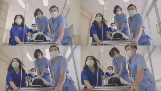 亚洲医疗队将心脏骤停的病人放在担架上进行心肺复苏高清在线视频素材下载