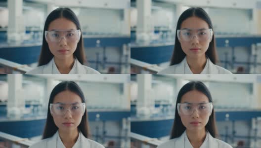 在商务中心戴防护眼镜的亚洲女性工业工程师高清在线视频素材下载